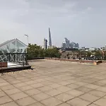High-Ceiling Flat With Rooftop & Skyline View