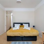 Homely 4-Bedroom Home With 2 Baths & Free Parking