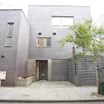 Spacious 3-Story Retreat With Rooftop Terrace And Modern Amenities