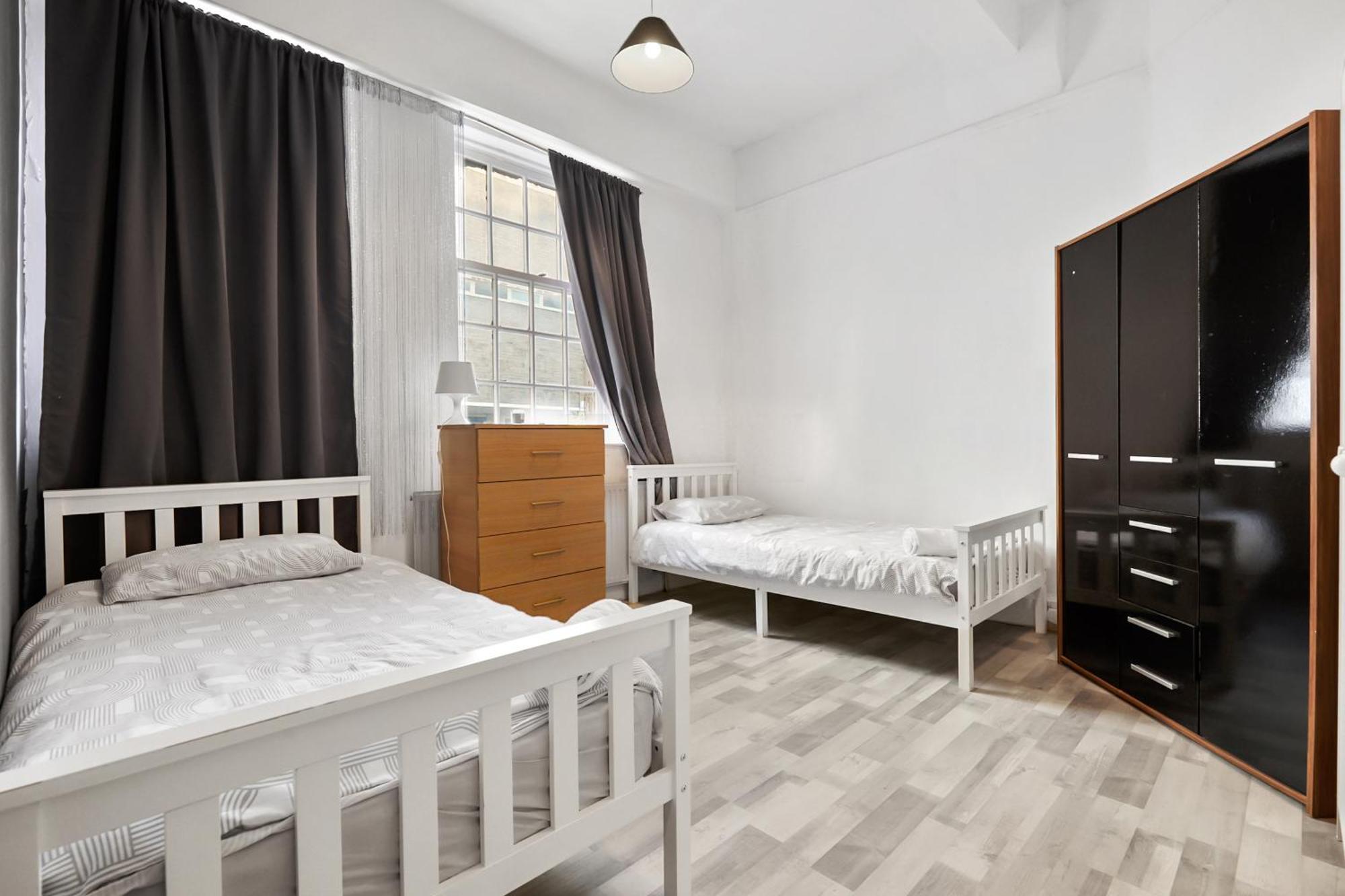 Quarto em Acomodações Particulares Cozy Twin Bed Retreat In Center Londres